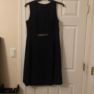 TAHARI women’s naval blue A line dress with gold hardware peek a boo neckline